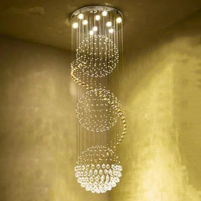 A modern spiral decorbites crystal led chandelier with cascading crystal beads and warm led lights in chrome finish