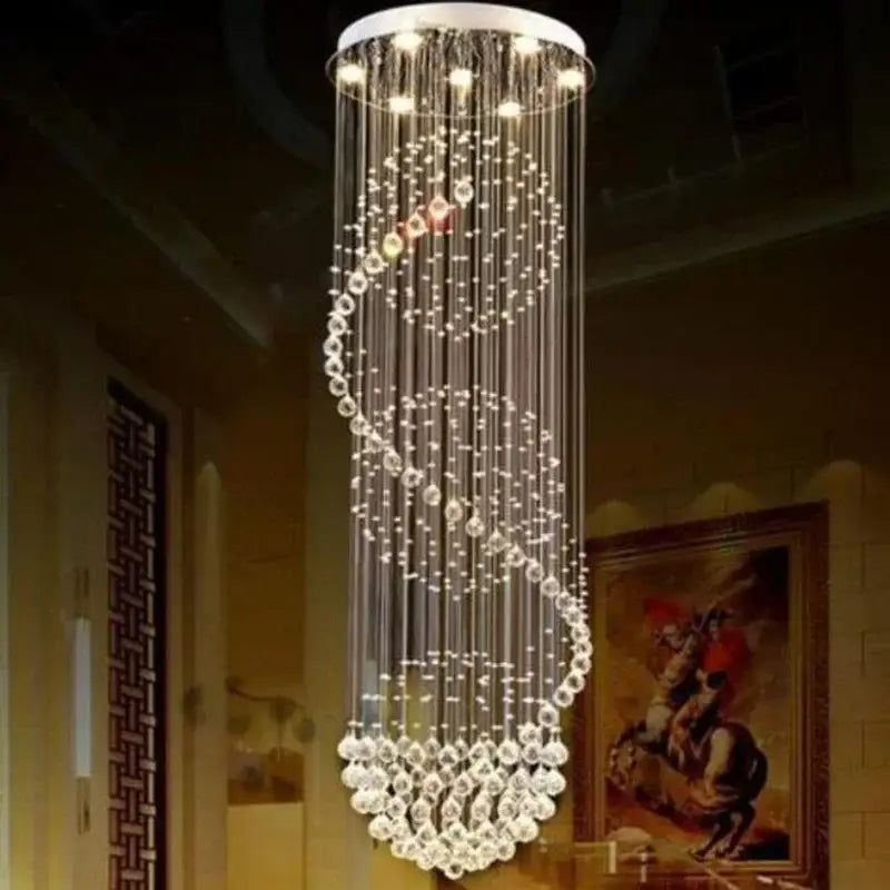 A modern decorbites crystal led chandelier with a sleek white top and spiral clear faceted crystal strands for dining rooms