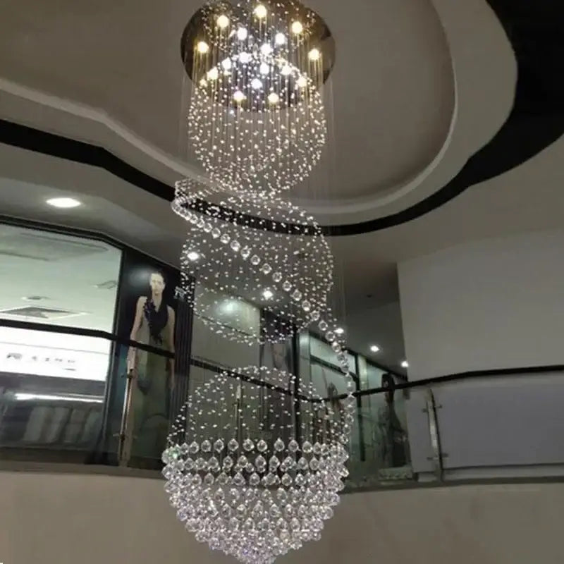 Modern spiral decorbites crystal led chandelier with cascading clear crystal droplets and central circular light fixture