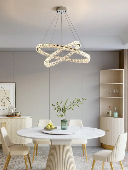 A modern double-looped decorbites crystal chandelier with a sleek metallic finish for living room decor