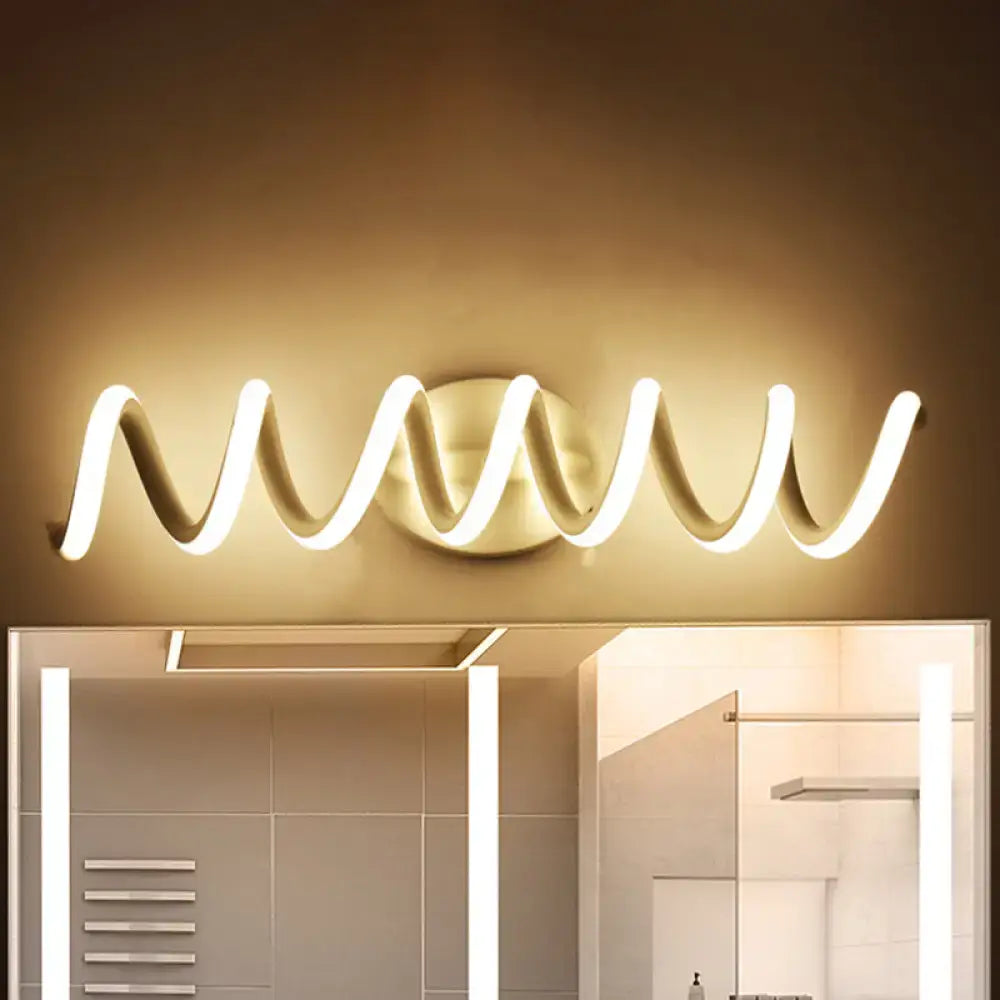 Modern gold-toned led bathroom mirror light with a sleek wavy design featuring natural warm white wall light illumination