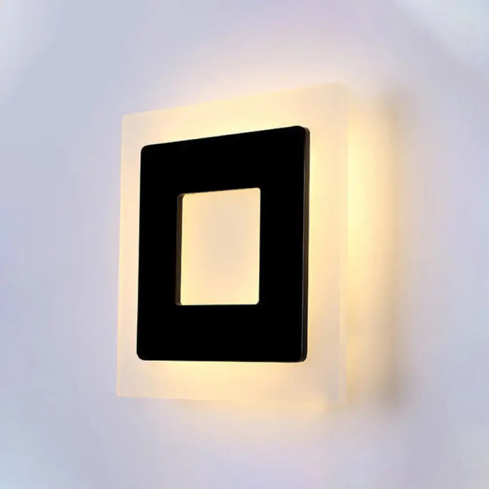 Modern square acrylic led wall sconce with black frame and off-white casing emitting warm white light for living room direct wired electric