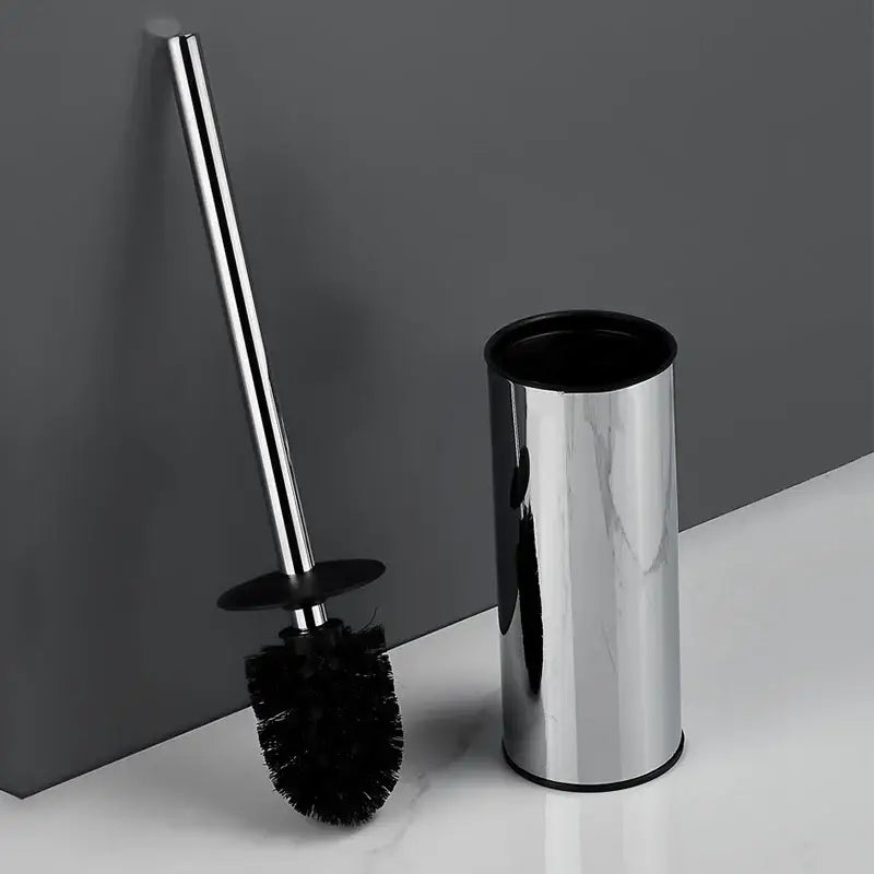 Modern chrome toilet brush set with black bristles and cylindrical holder for bathroom use in wall mount design