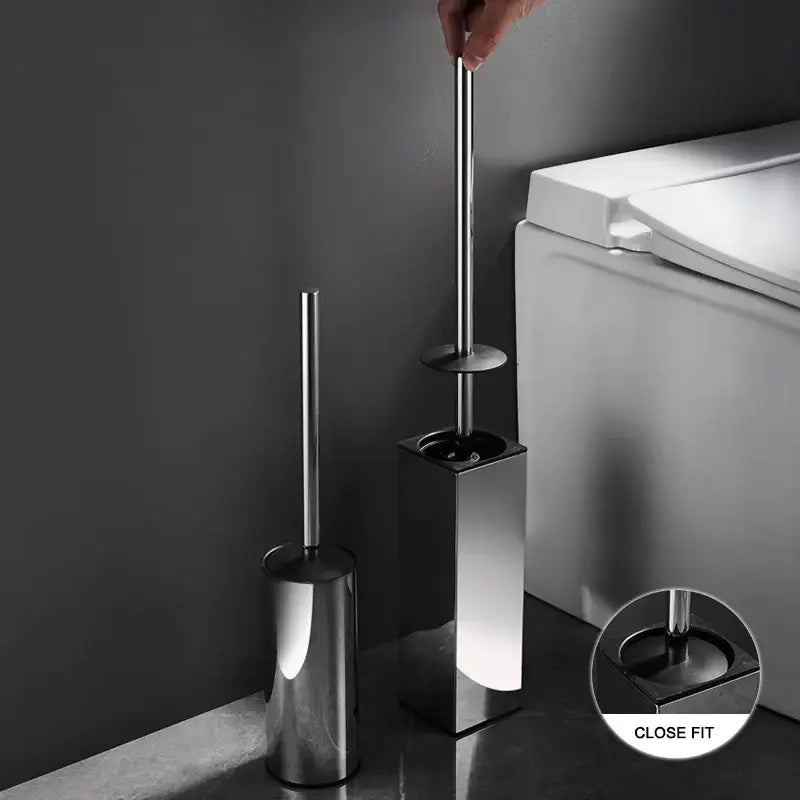 Shiny chrome-finished toilet brush set with sleek cylindrical handle and matching square base for modern bathroom use