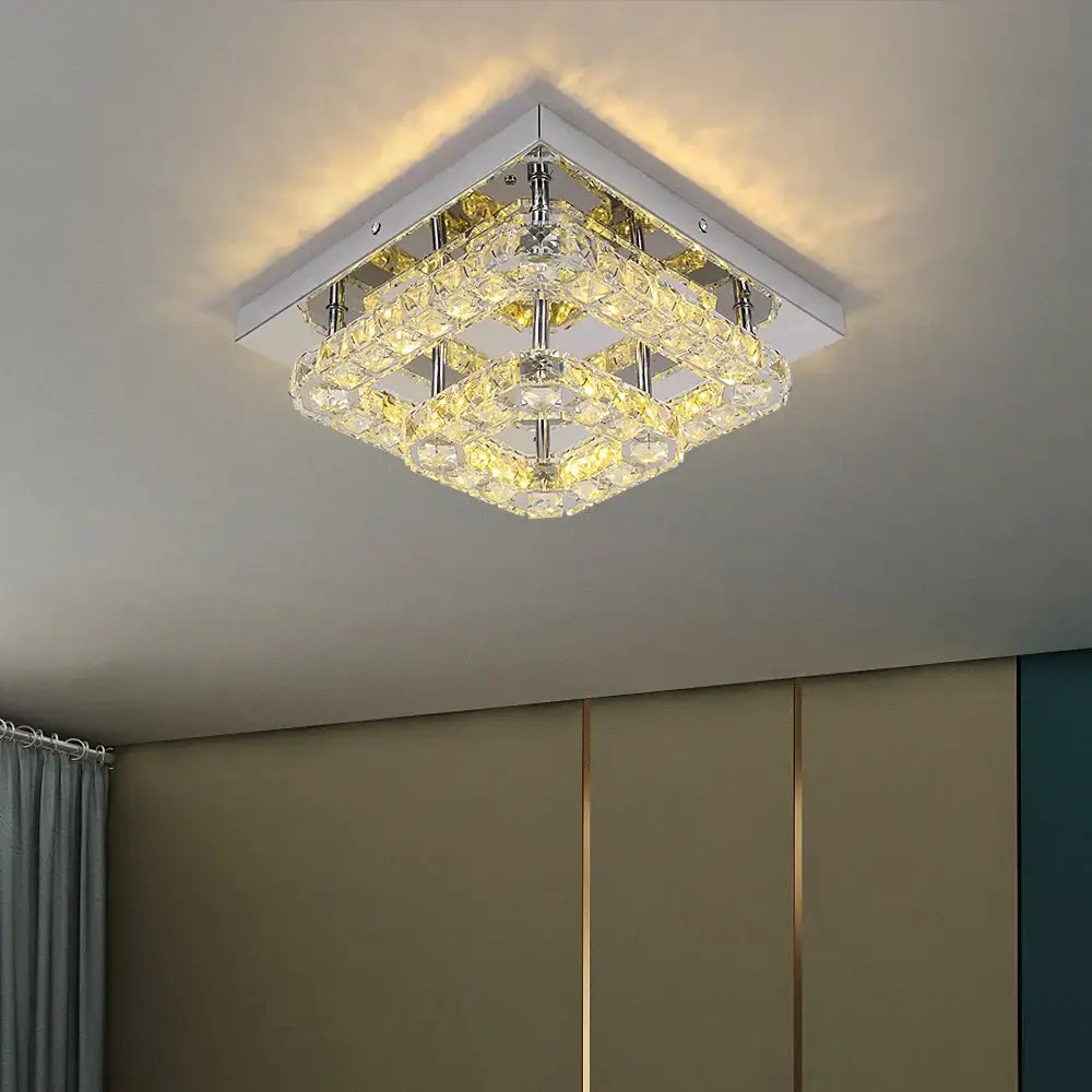 Modern square chrome crystal led ceiling light with layered faceted crystals emitting warm light for living room use