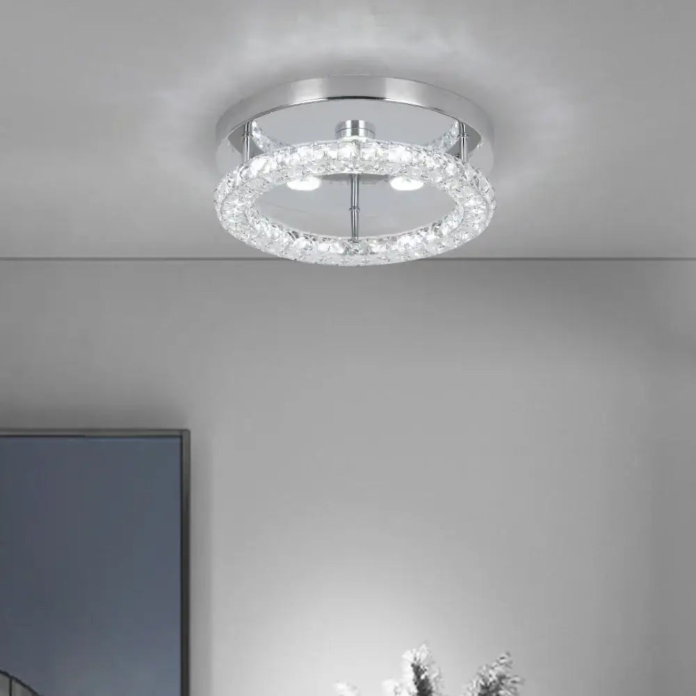 Modern flush mount ceiling light with chrome finish and outer ring of clear faceted crystals for kitchen use