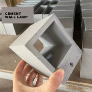 Modern square gray cement wall lamp with hollow design and textured surface for kitchen decorbites cement wall sconce