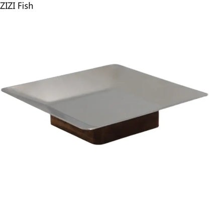 Modern square stainless steel fruit bowl tray with dark wood base for living room display and serving