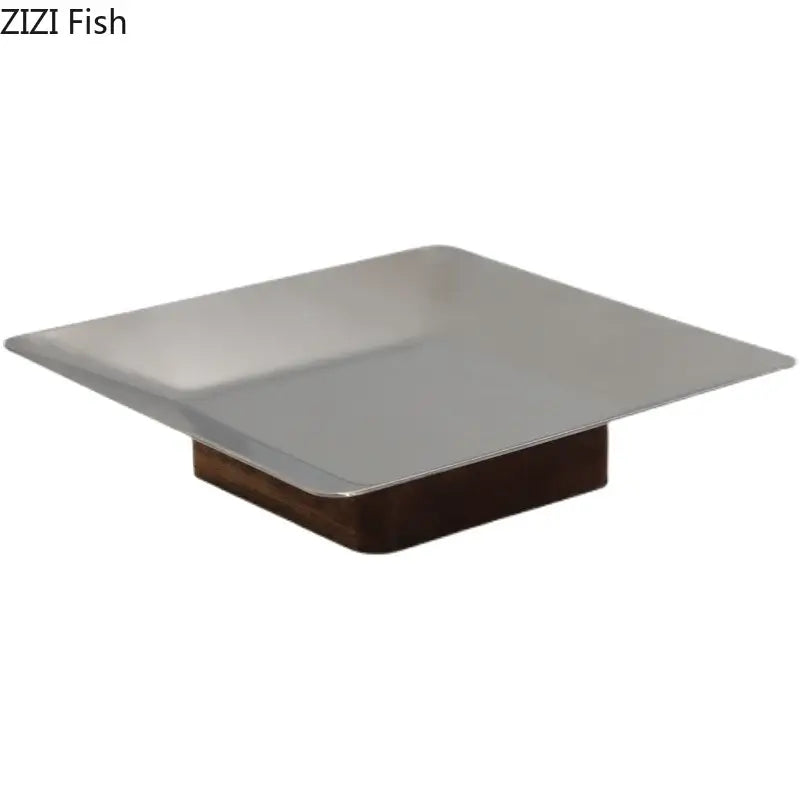 Modern square stainless steel fruit bowl tray with dark wood base for living room display and serving