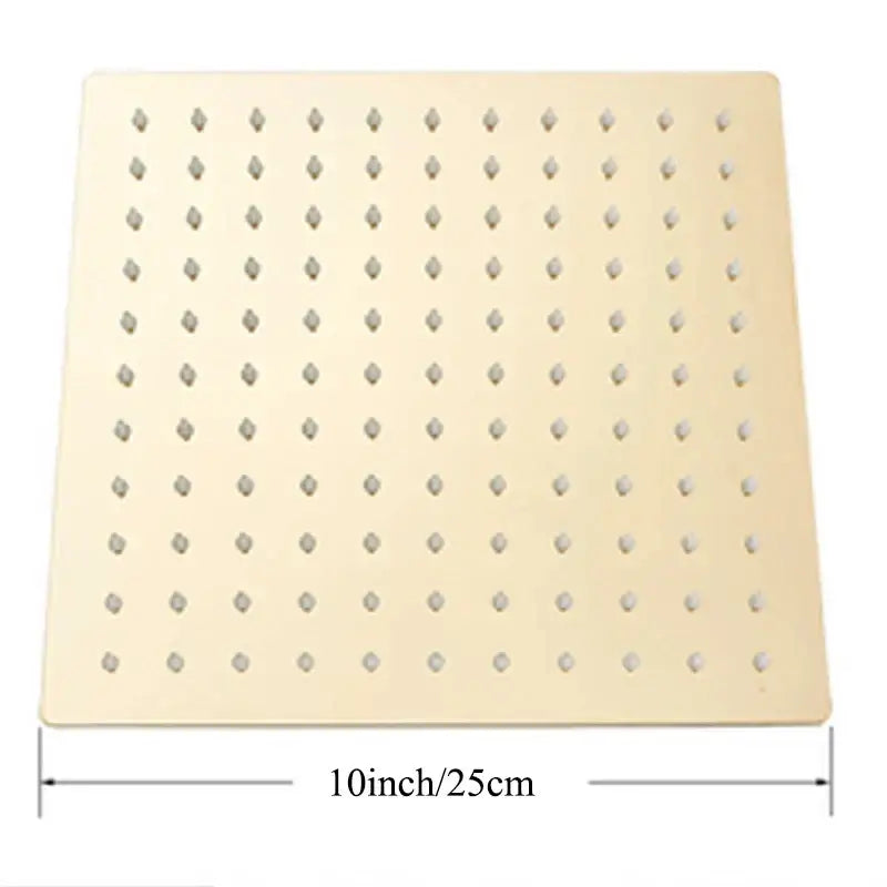 Modern square rain shower head with light beige pegboard featuring small diamond-shaped holes for rainfall spray
