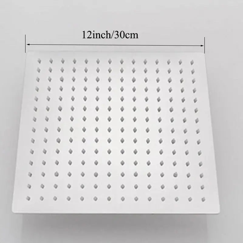 White square rain shower head with chrome finish and diamond-shaped nozzles for modern bathroom rainfall spray