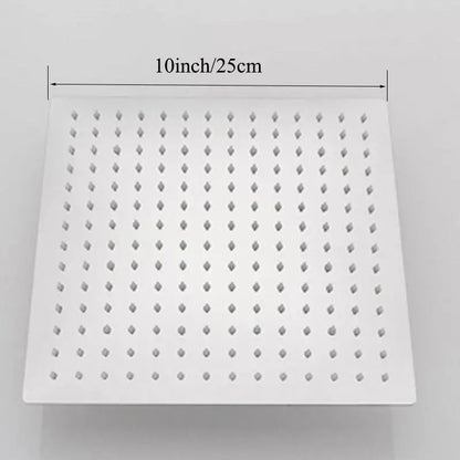 Modern square rain shower head in chrome with white diamond-shaped nozzles for an even rainfall spray