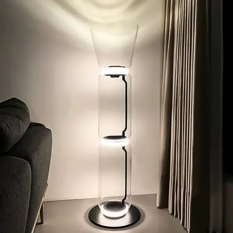 Modern stacked glass led floor lamp with transparent cylindrical body and soft white led lighting for living room use