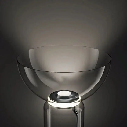 Modern stacked glass led floor lamp with a sleek transparent design and glowing circular base for living room lighting