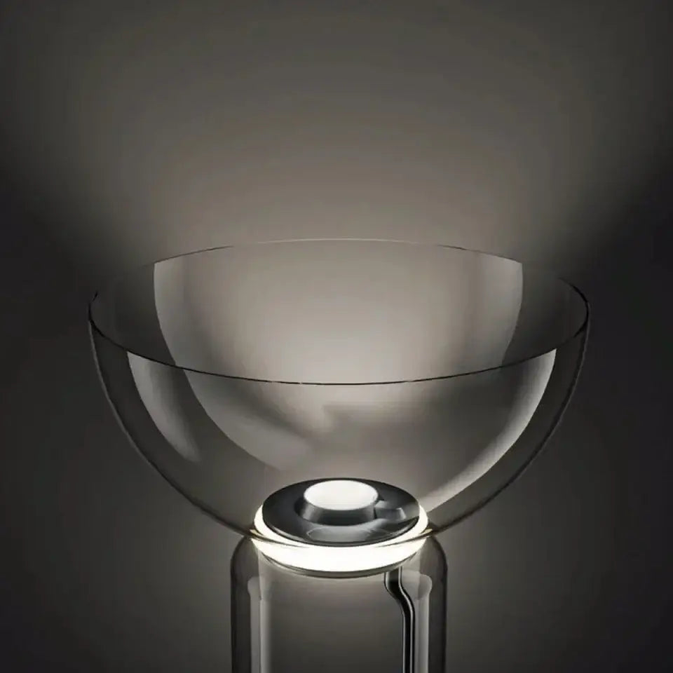 Modern stacked glass led floor lamp with a sleek transparent design and glowing circular base for living room lighting