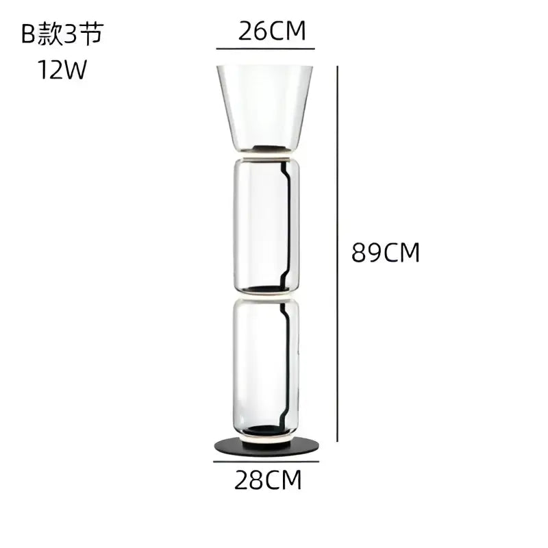 Modern stacked glass led floor lamp with tall transparent three-section design and black circular base for living room lighting
