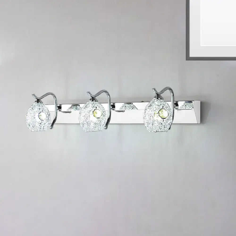 Modern stainless steel wall light with three chrome-finished textured glass globes providing warm white light