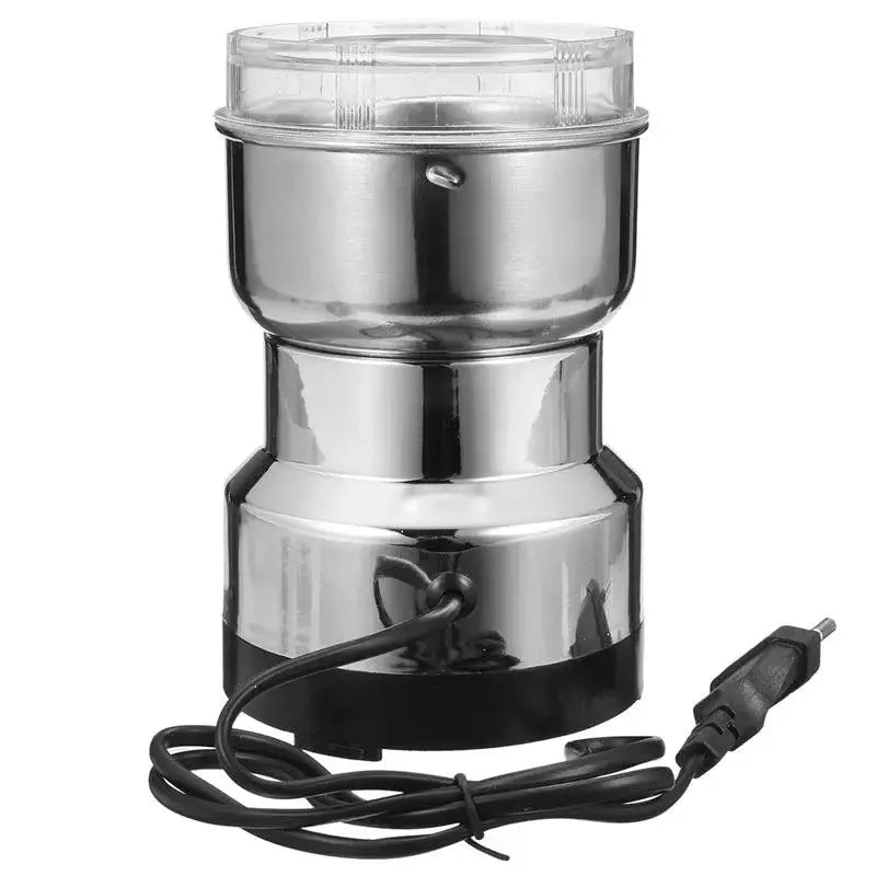 Modern stainless steel electric grinder with clear lid and black power cord for grinding grains in kitchen