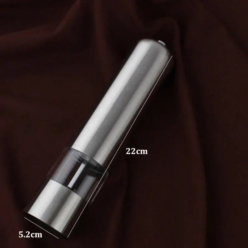 A sleek 22cm electric salt pepper grinder with polished stainless steel body and transparent acrylic section