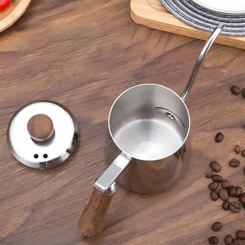 Modern stainless steel gooseneck drip coffee pot featuring a decorbites gooseneck stainless steel pitcher with wooden handle and lid