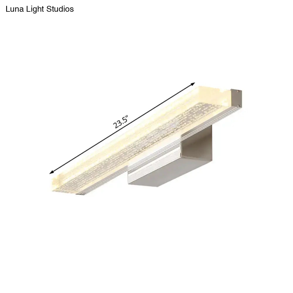A sleek stainless steel 23.5 inch modern led bathroom vanity light with frosted shade and crystal accents