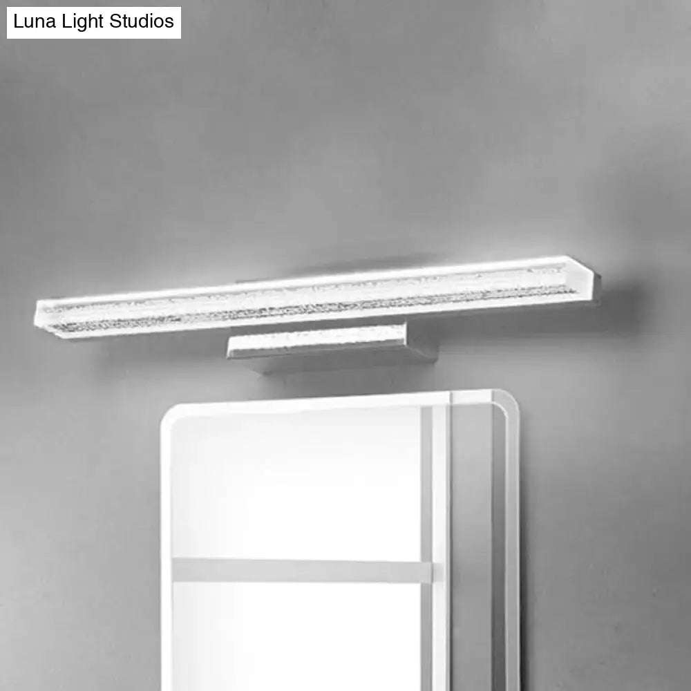 Modern stainless steel led bathroom light with frosted shade and sleek white rectangular vanity light with crystal accents