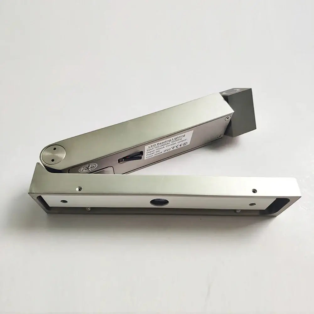 Silver metallic led retracting door closer with sleek rectangular design and mounting hardware for led bedside wall light decorbites