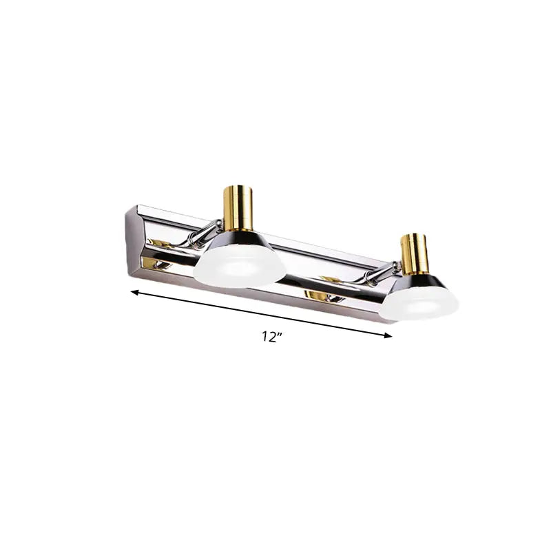 Modern stainless steel wall light with polished chrome and gold accents featuring frosted acrylic cone shades