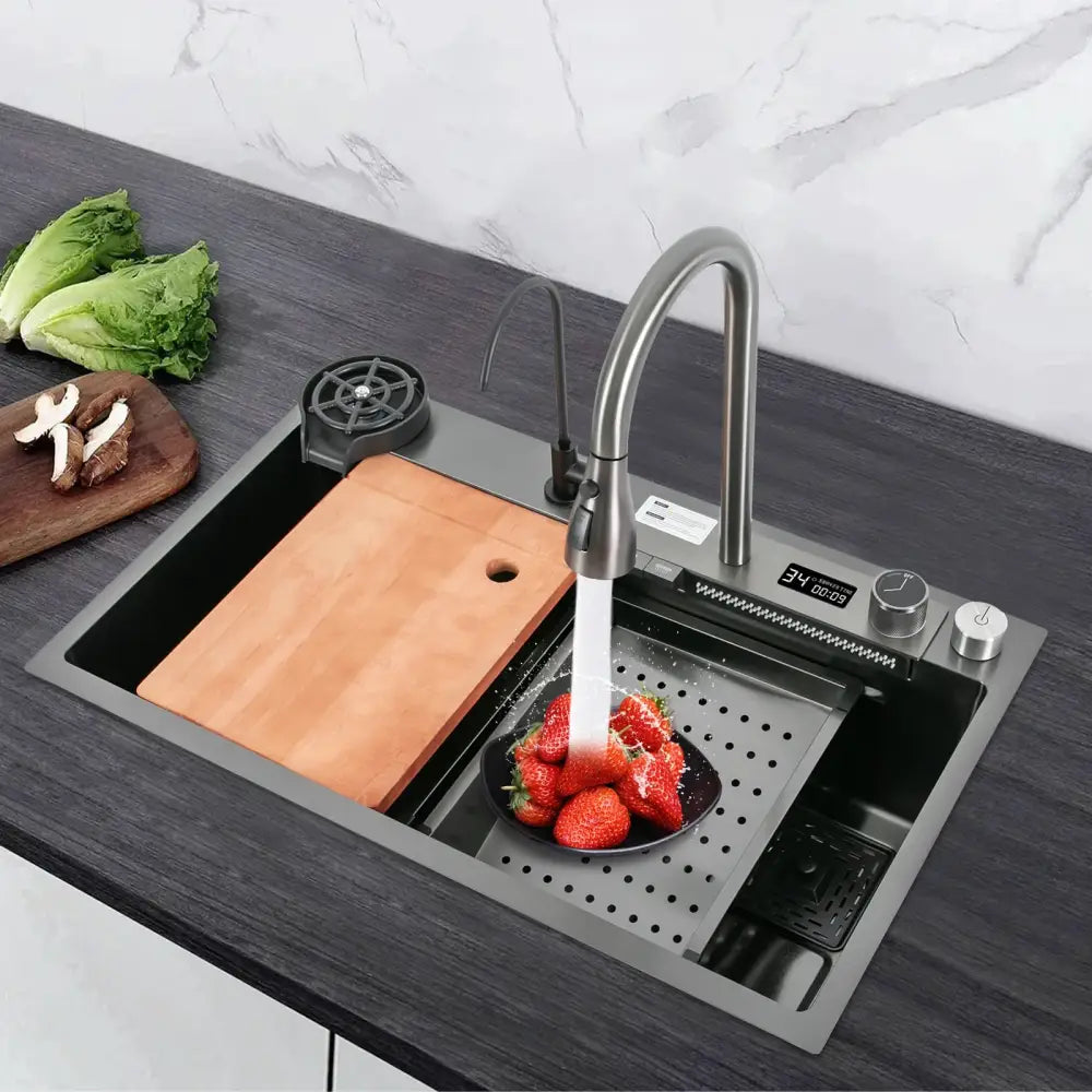 Modern stainless steel waterfall kitchen sink with sleek curved pull out faucet and integrated digital display
