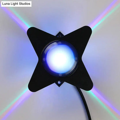 Modern black star-shaped petals outdoor wall led light with blue bulb emitting colorful rainbow beams for garden use