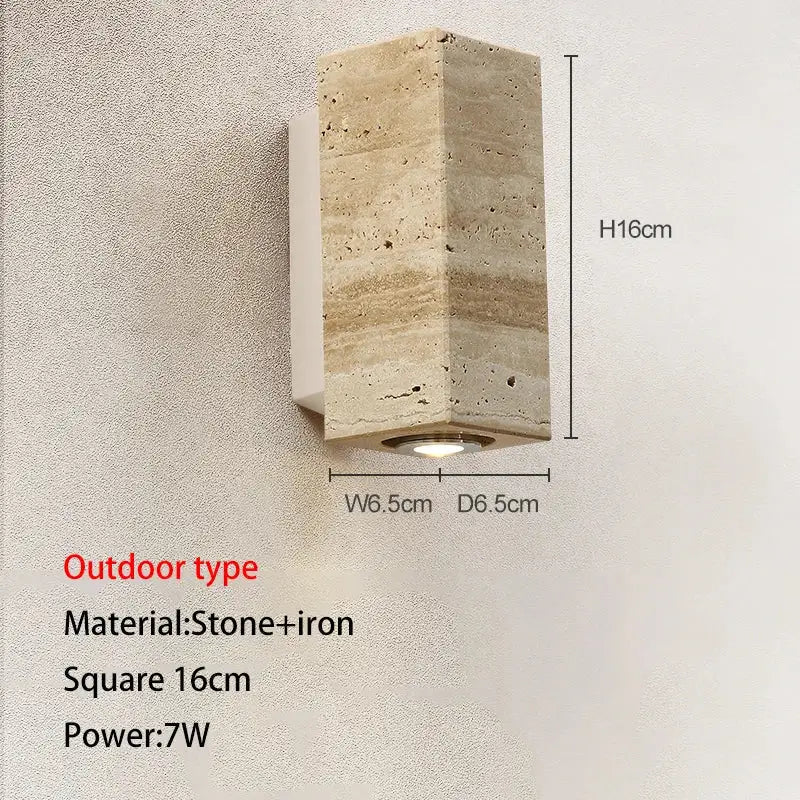 A modern wall lamp in textured beige cave stone and iron with integrated led light for decorbites cave stone outdoor use