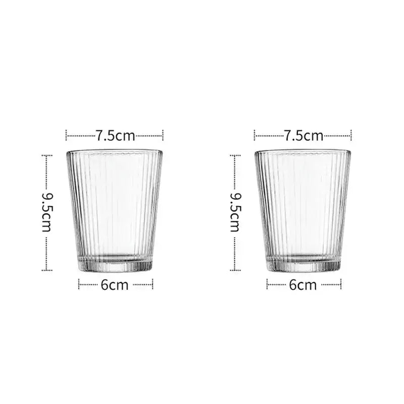 Clear glass tumblers with vertical ribbed texture and sturdy base in a modern striped glass cold water kettle set with silver lid