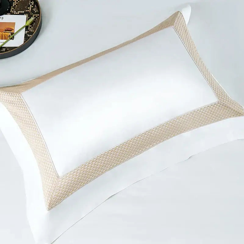 White pillow with textured beige border from modern striped white and beige king size luxury cotton bedding set decorbites