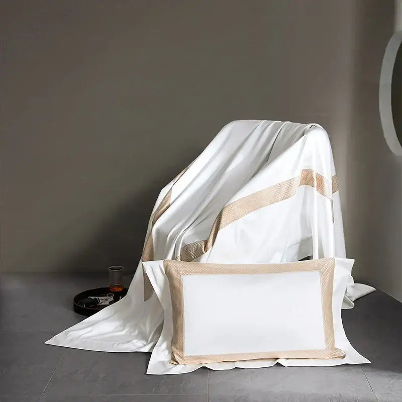 White satin pillowcase with beige textured border part of modern striped white and beige king size luxury bedding set decorbites
