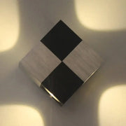 A modern style black and silver wood-grain magnetic cube led wall lamp providing warm lighting 220v-240v