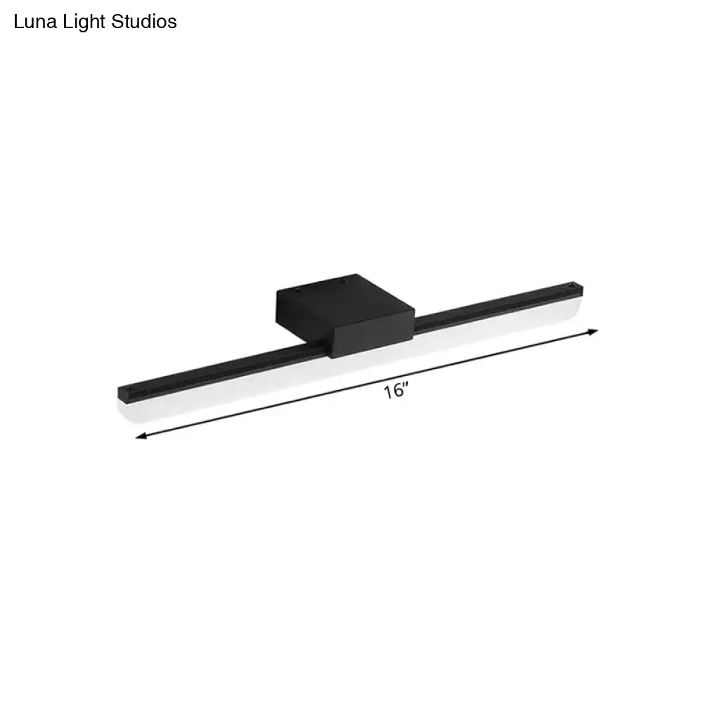 Black modern style led wall light with sleek rectangular design and 16-inch length emitting white light for bedrooms