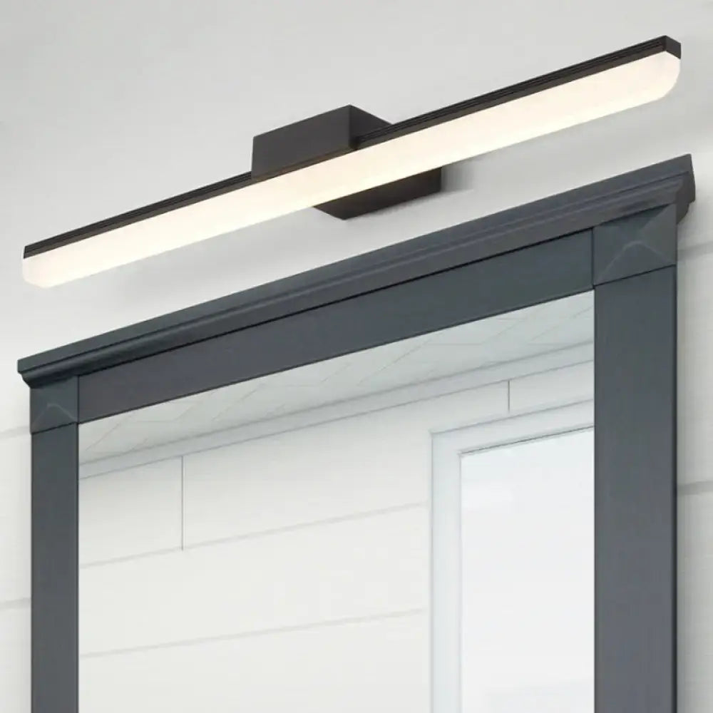 Modern style black rectangular led wall light with sleek minimalist design emitting white light mounted above mirror