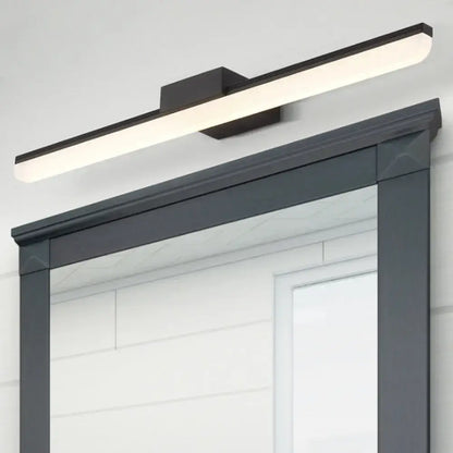 Modern style black rectangular led wall light with sleek minimalist design emitting white light mounted above mirror