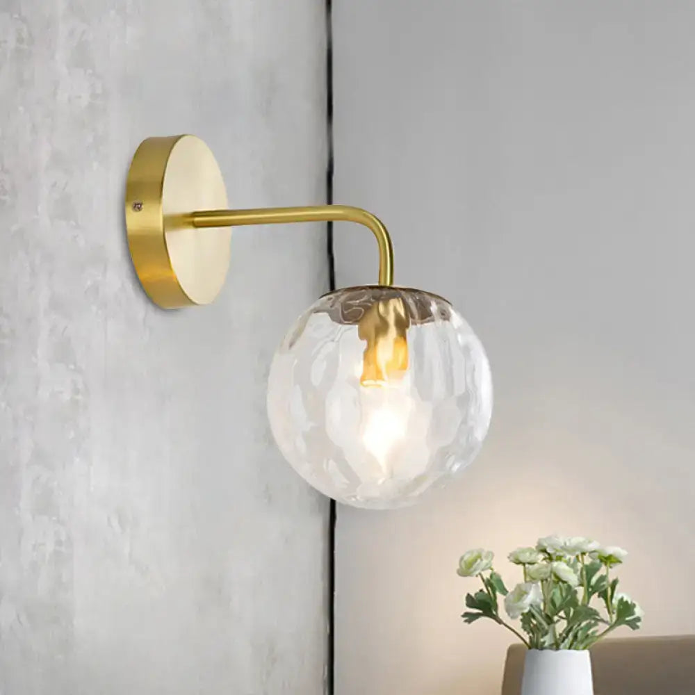 Modern style gold color wall sconce with hammered clear textured glass globe for living room lighting