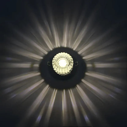 Modern sunburst crystal led flush mount ceiling light with faceted crystal center emitting warm white illumination