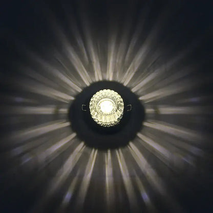 A modern sunburst decorbites crystal led flush mount ceiling light with faceted crystal center emits warm white illumination