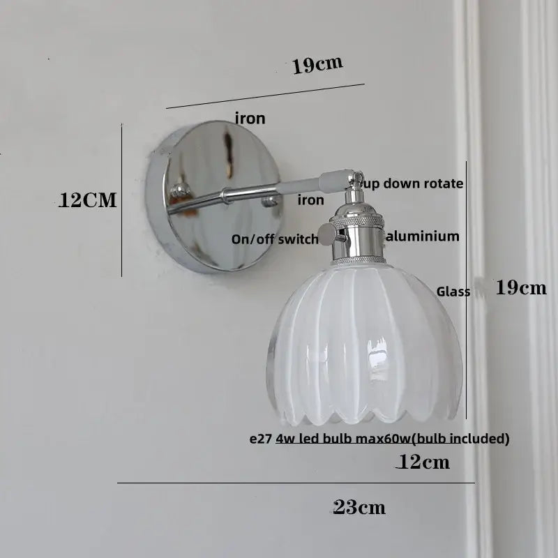 A sleek modern wall light with polished chrome iron ceramic led base and white ribbed glass shade for living room decorbites