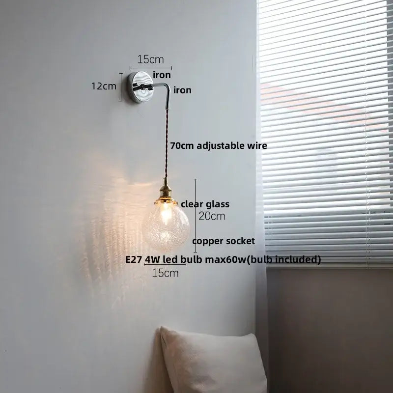 Modern sunset glass led wall sconce with clear glass globe pendant light, copper socket, and adjustable iron arm for decorbites ceramic led wall