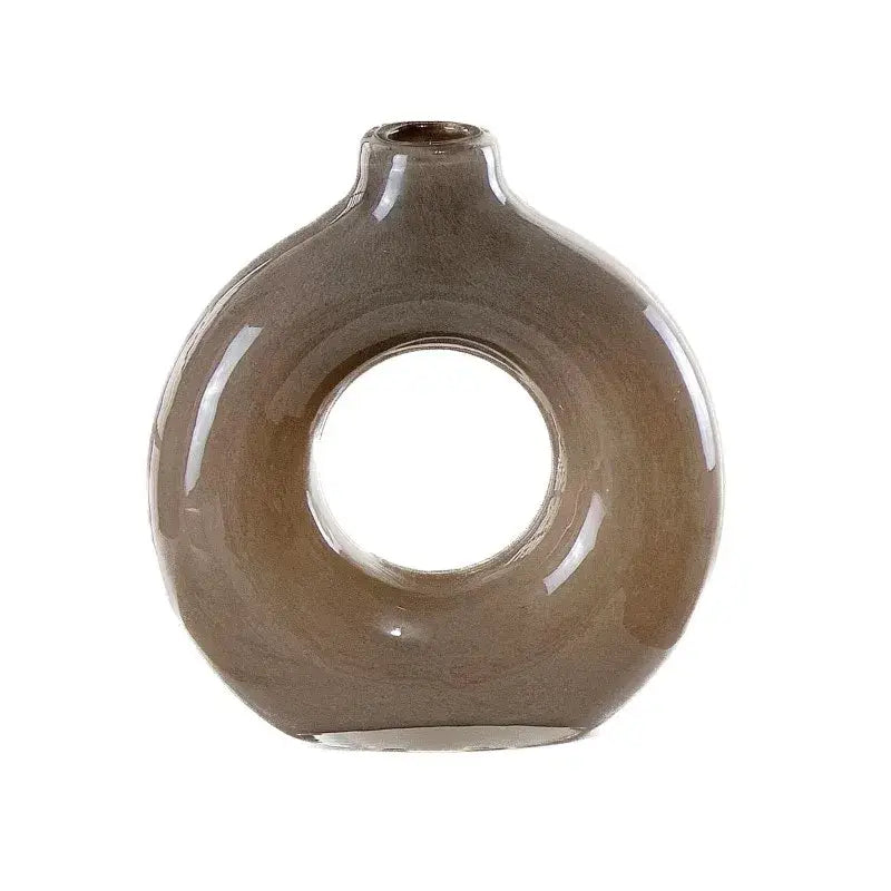 A sleek matte taupe ceramic vase with a modern donut shape and narrow neck for decorbites geometric circles decor