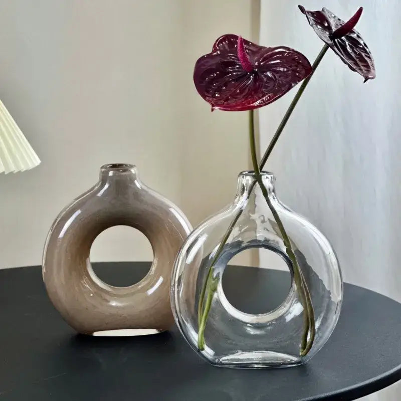 Modern taupe and clear geometric circles glass vase with a rounded bulbous shape and distinctive circular hole decorbites geometric circles