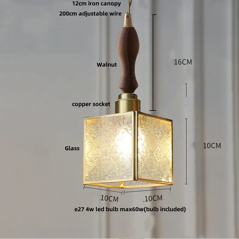 A modern pendant lamp with a brass frame, etched glass panels, and walnut handle for decorbites copper glass led lighting