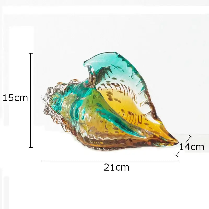 A vibrant translucent teal and amber glass conch shell statue for modern living room decor