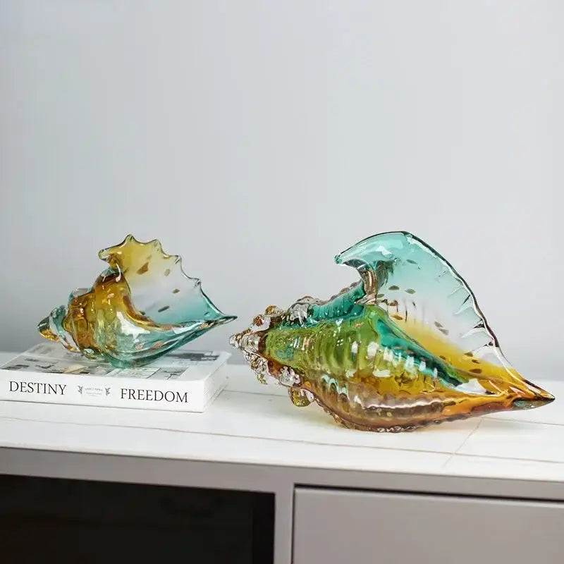 Vibrant hand-blown glass conch shell statue with swirling teal and amber hues for modern living room decor