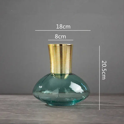 A sleek teal glass vase with a textured decorbites gold metal neck for modern living room decor