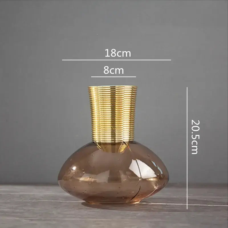 A sleek amber glass metal glass vase with textured gold metal neck for modern teal and amber gold metal decorbites decor
